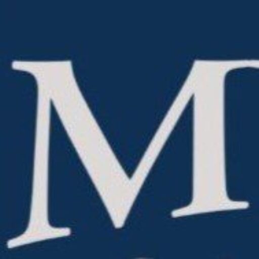 Large serif letter M on dark blue background